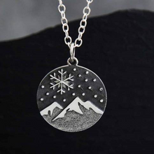 Load image into Gallery viewer, Sterling silver mountain and snowflake necklace