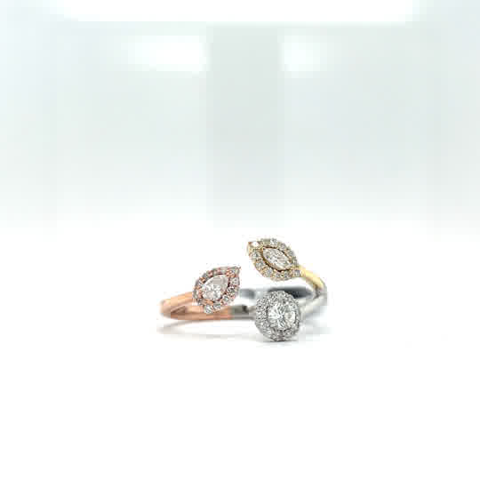 14k yellow, rose, and white gold ring with a round, marquis, and pear shaped diamonds 0.965ctw