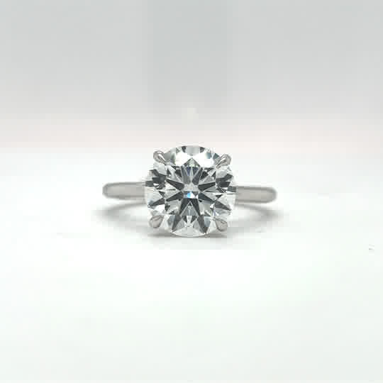 Solitaire engagement ring with 3.00ct round E VS1 IGI lab grown diamond and 0.07ct E-F VS1 round diamonds.
